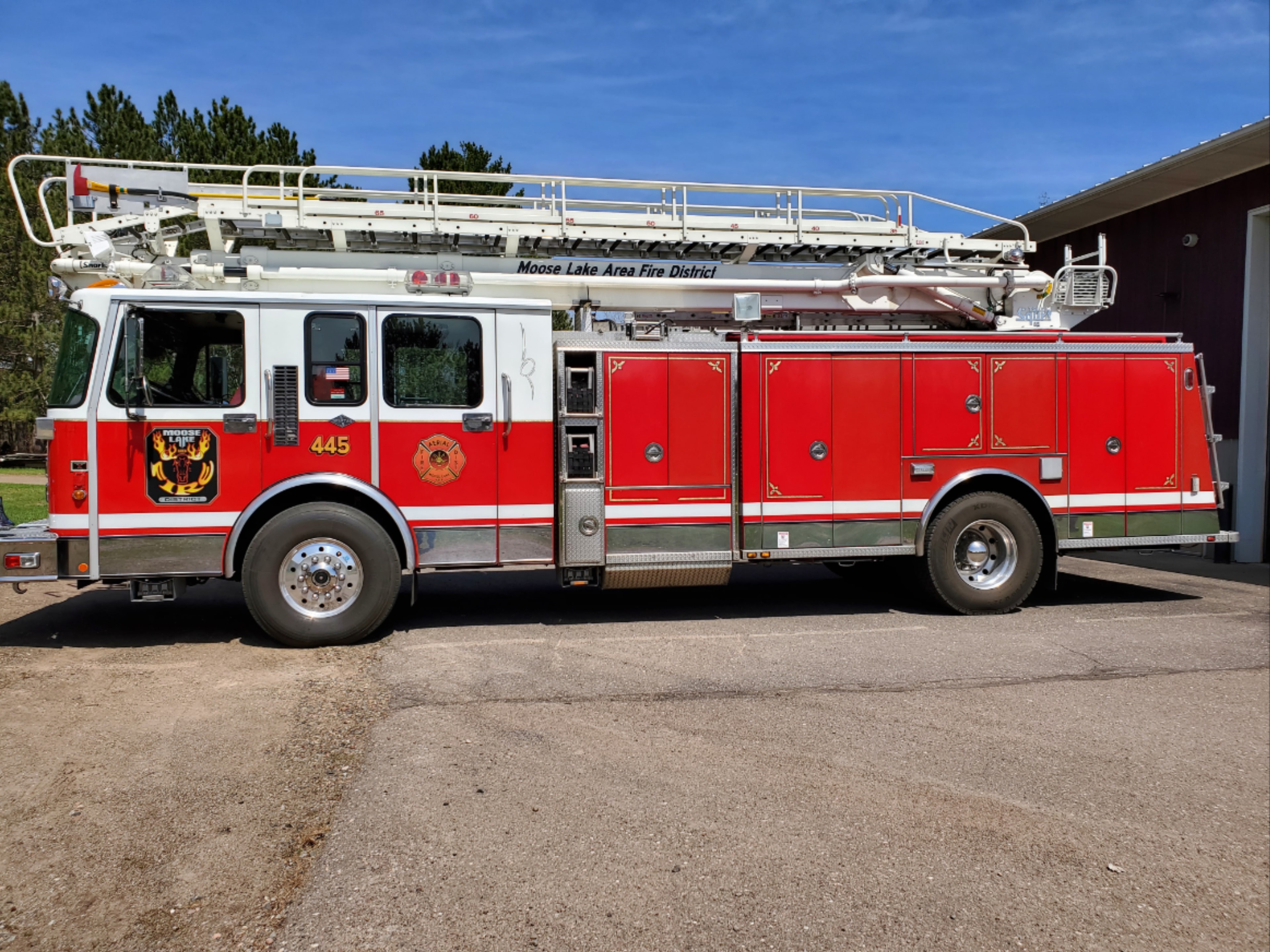 Moose Lake Fire trucks responding to a winter scene