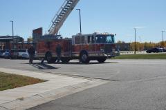 Red fire truck with extended ladder on paved surface — fire prevention 2020