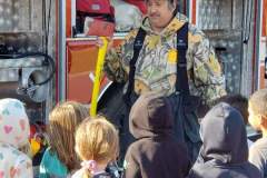 Street performer in colorful costume — fire prevention Moose Lake School 2022