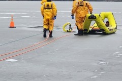 Emergency response personnel on airport tarmac — ice rescue training 2023