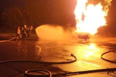 Firefighters battling massive vehicle fire at night — propane emergency training 2023