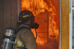 Firefighter at doorway — Training Burn July 2025