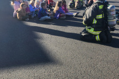 First responders in high-visibility gear at emergency scene — fire prevention October 2024