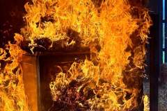 Close-up of intense orange and yellow flames — kitchen fire May 2024