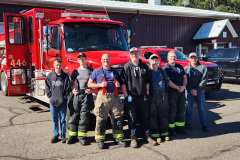 Firefighters and emergency personnel group photo — fire prevention 2025