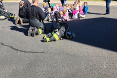 Group gathered on paved surface — fire prevention 2025