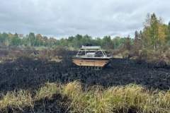 White SUV on charred landscape — County Road 11 wildland fire 2023