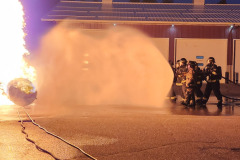 Fire truck spraying water cannon — propane burn training November 2025