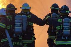 Four firefighters in full gear from behind — propane emergency training 2023