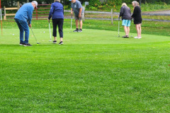 Golfers on field — golf scramble fundraiser September 2025