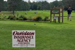 Outdoor event on large green field — golf scramble fundraiser 2023