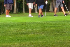 Group on green lawn — golf scramble fundraiser September 2025