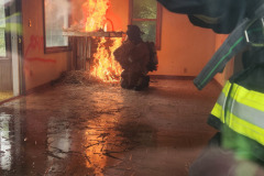 Firefighter spraying water — Training Burn July 2025